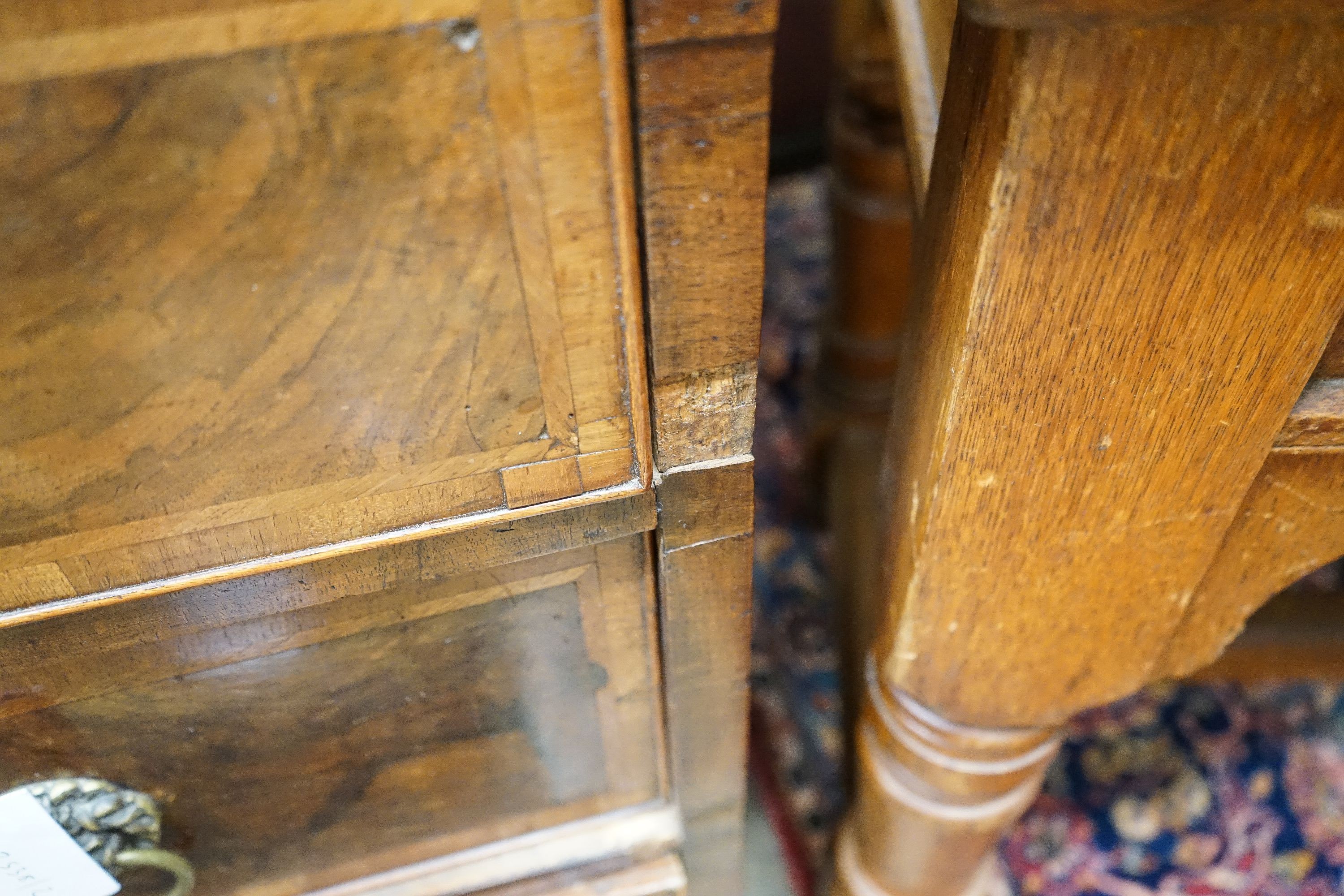 A walnut and oak chest of drawers, width 103cm, depth 52cm, height 82cm